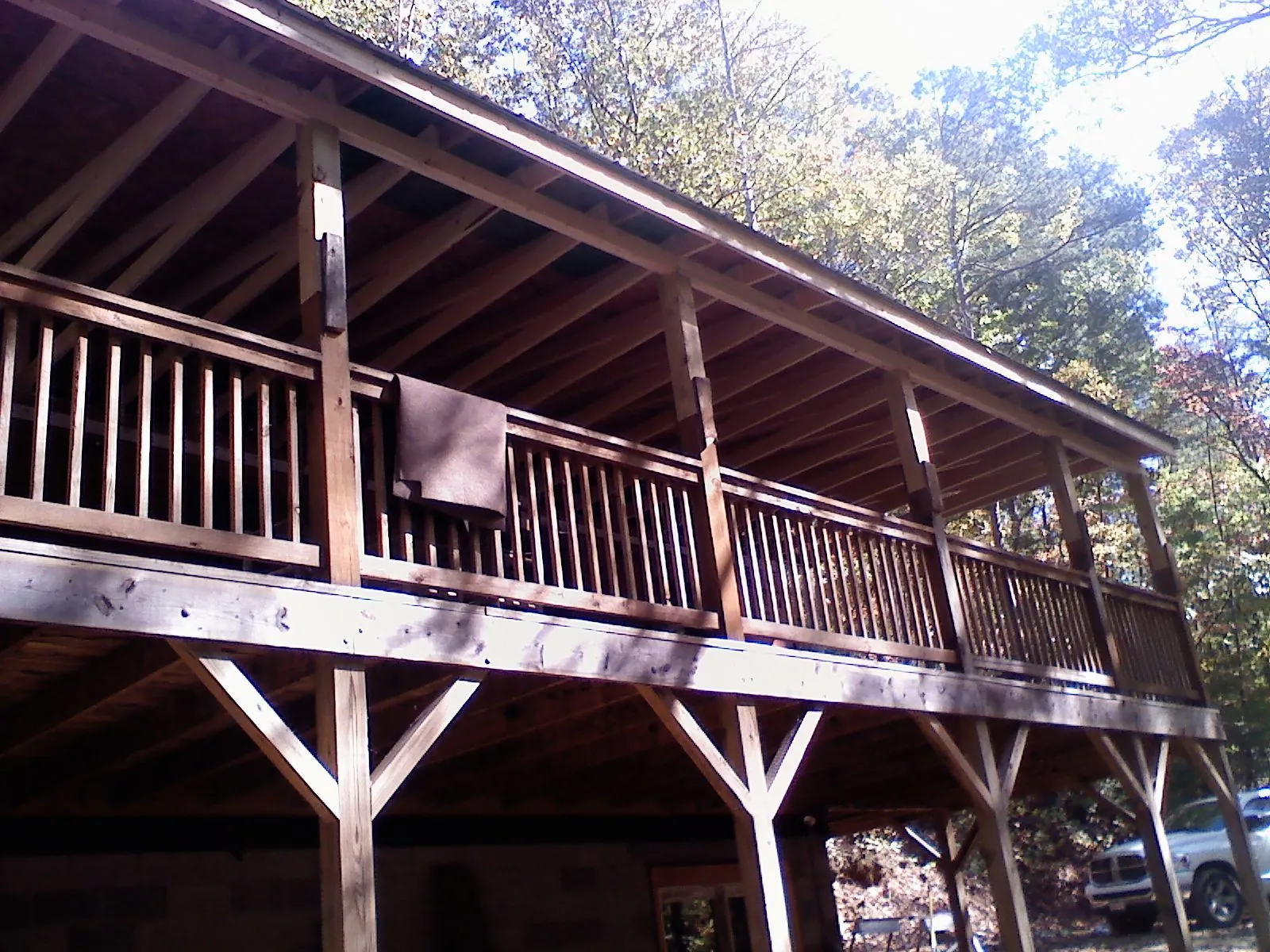 Timber framing under a new elevated porch and deck — Roof Leak Repair in New Goshen by Roofing Brothers